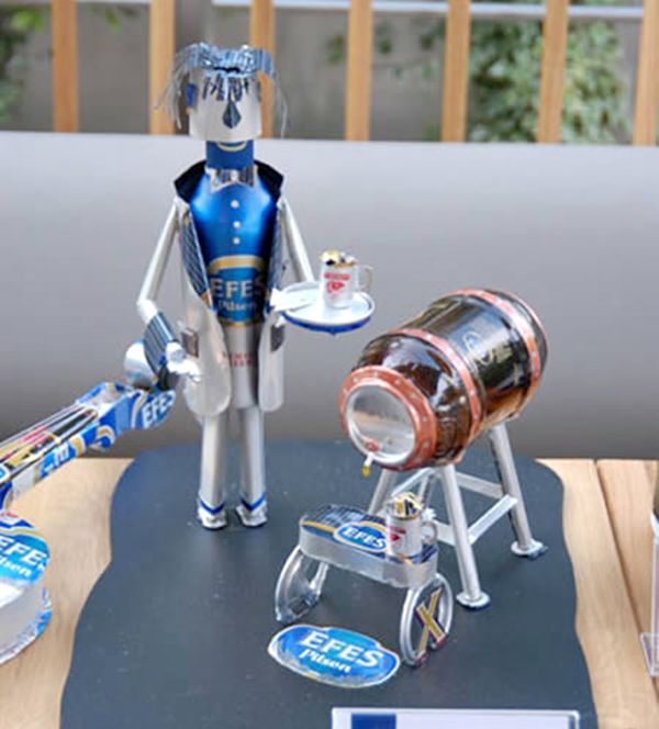 A waiter made from beer cans