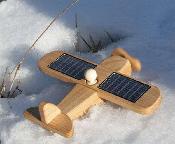 Solar powered wooden toy airplane