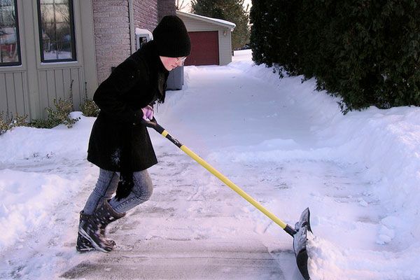 shoveling off the snow from the driveway