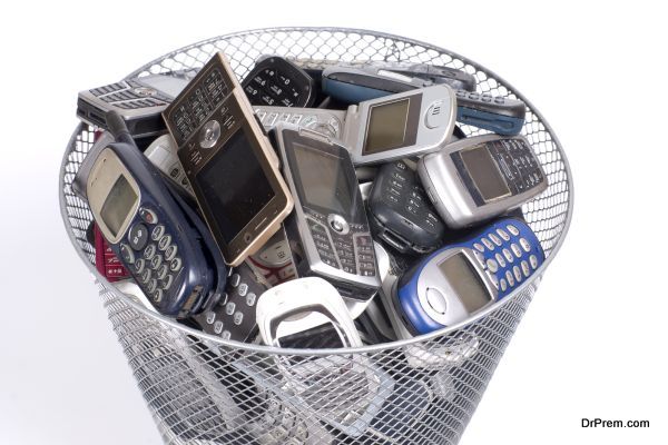 rubbish bin full of old cellphones