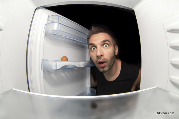 man and an empty fridge