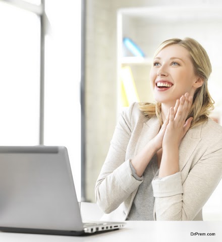 happy woman with laptop computer