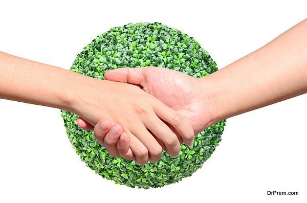 Partner hand between man and woman on green planet world