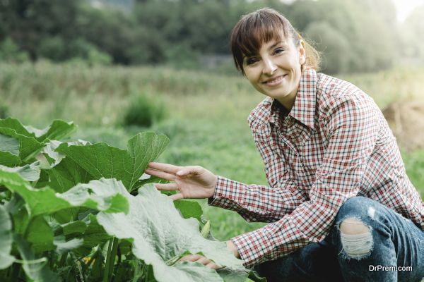 Happy gardener posing with plants