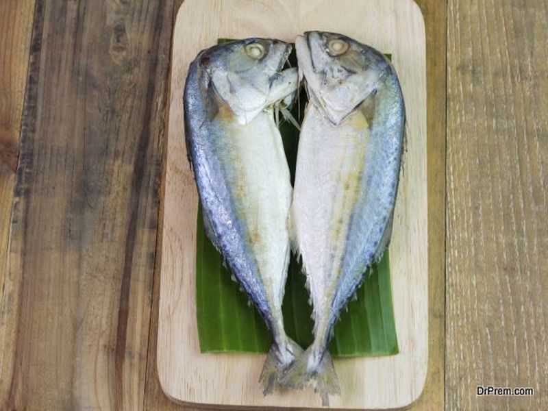 Steamed mackerel or tuna steamed on wooden background